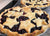 Two of the best blueberry pie recipe pies on a baking sheet