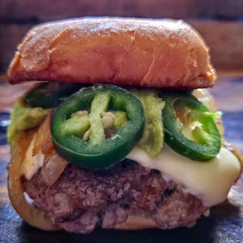 a jalapeno smash burger with pepper jack cheese