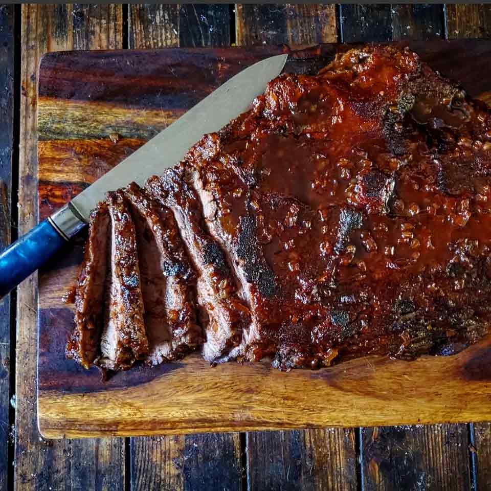 A fully cooked Felton Angus Beef oven bbq brisket flat on a cutting board.